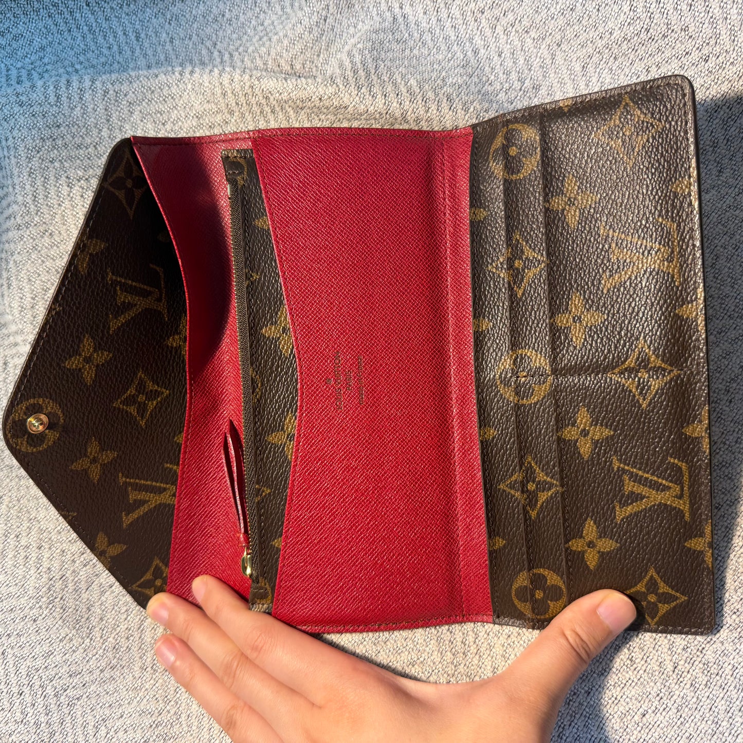 Louis Vuitton - Portefeuille Emilie - Monogram coated canvas exterior, grained leather interior - Monogram Brown with Red accents - (medium)