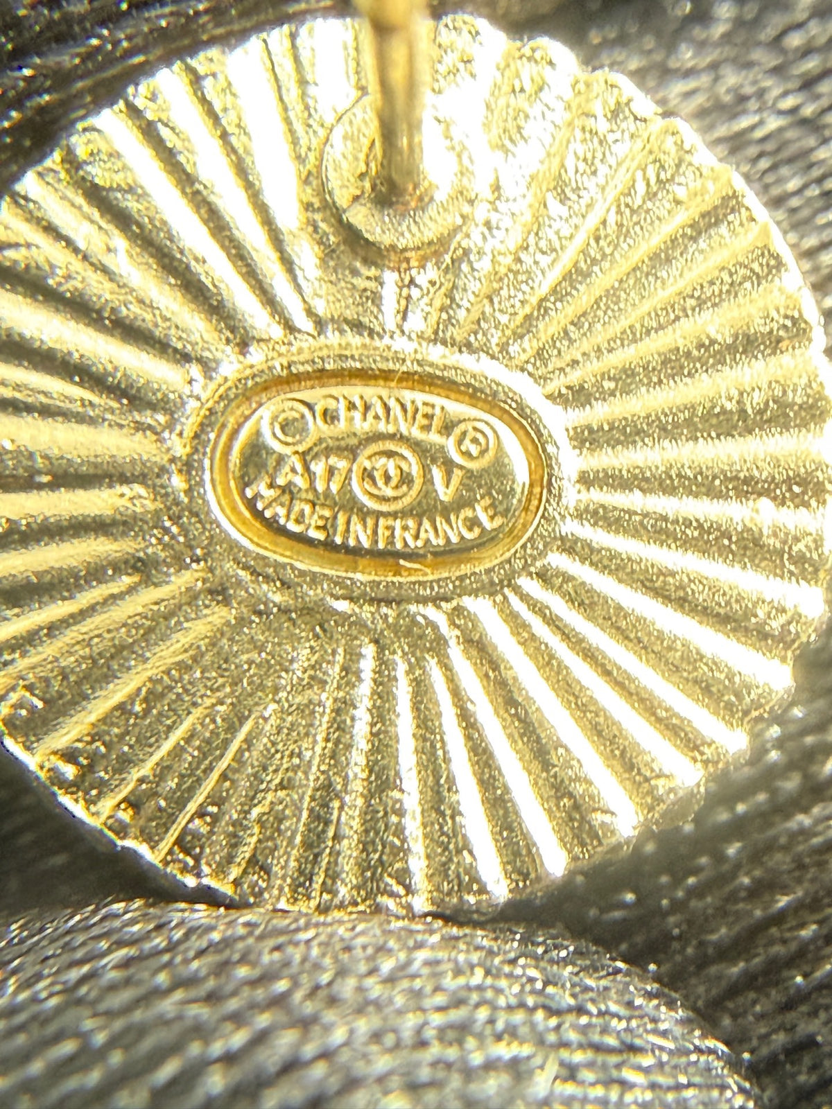 Chanel - Other - Gold-tone metal with a black enamel or resin centre; exact centre material is unconfirmed. - Black
