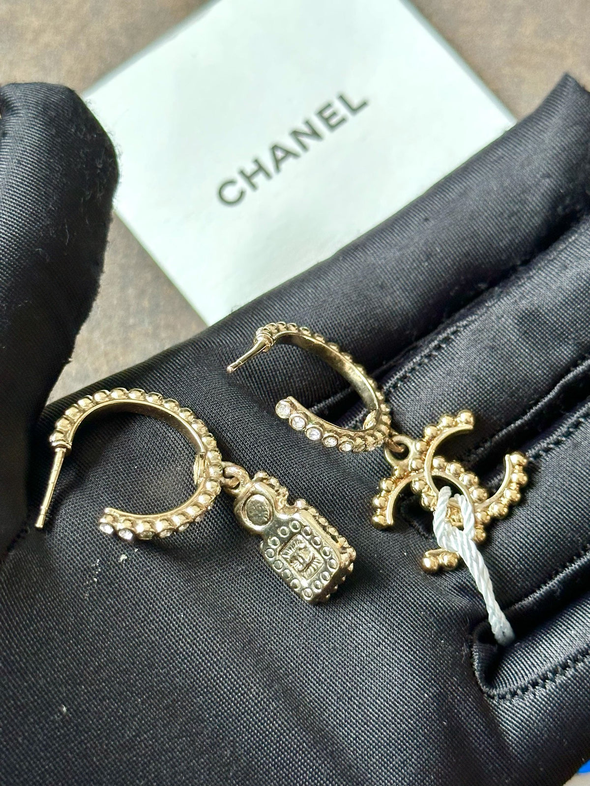 Chanel - Other - Gold-tone metal with clear rhinestone accents, a faux pearl and pale iridescent details. - Gold