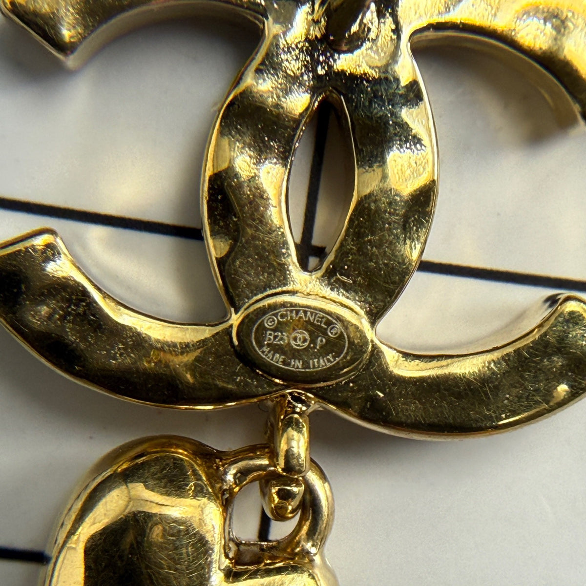 Chanel - Other - Gold-tone metal with clear rhinestone embellishments and dangling heart charms. - Gold