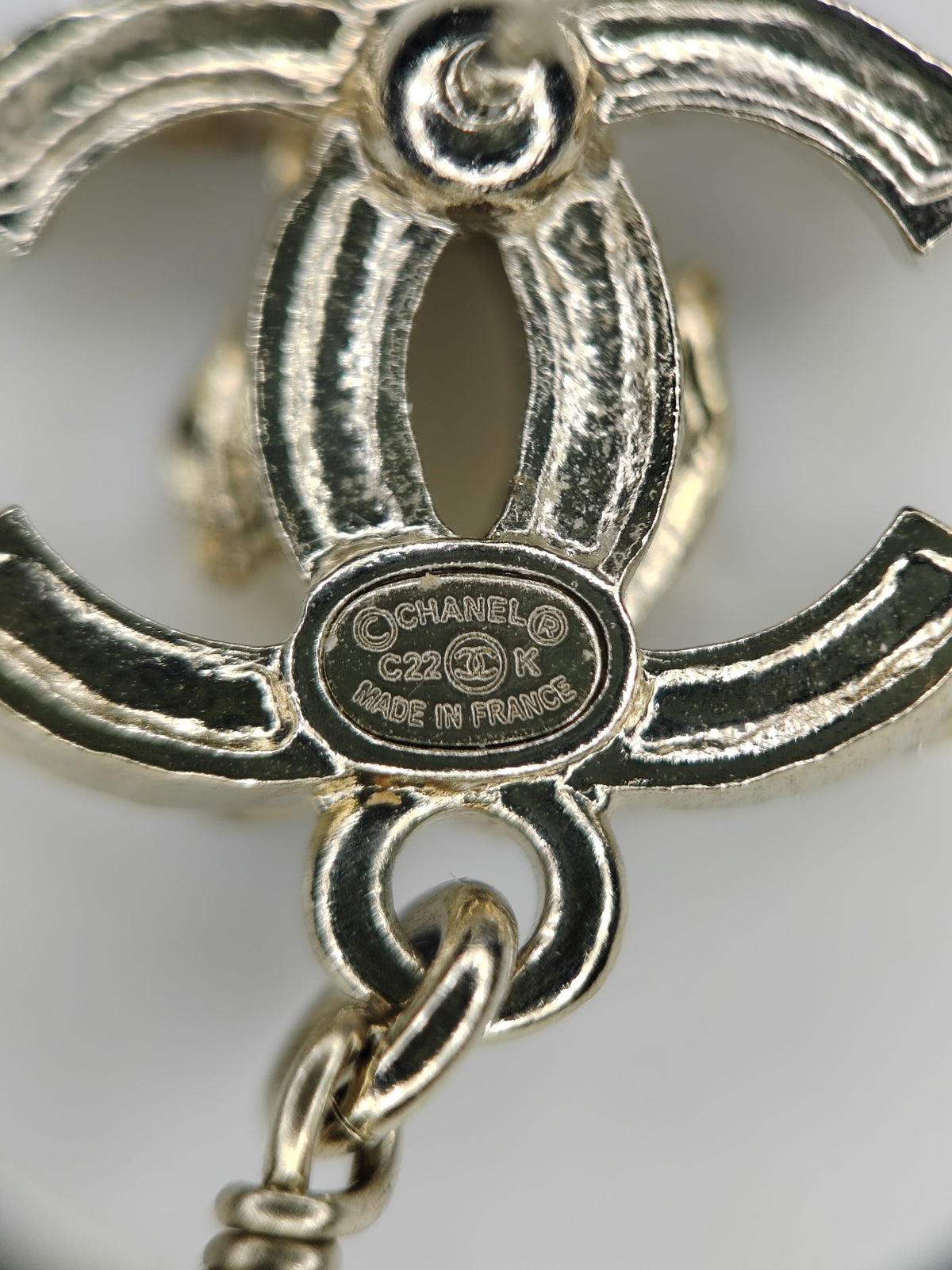 Chanel - Other - Gold-tone metal with rhinestone-style stones and pearl-like and black decorative elements; exact stone and pearl composition is not confirmed. - Multicolour
