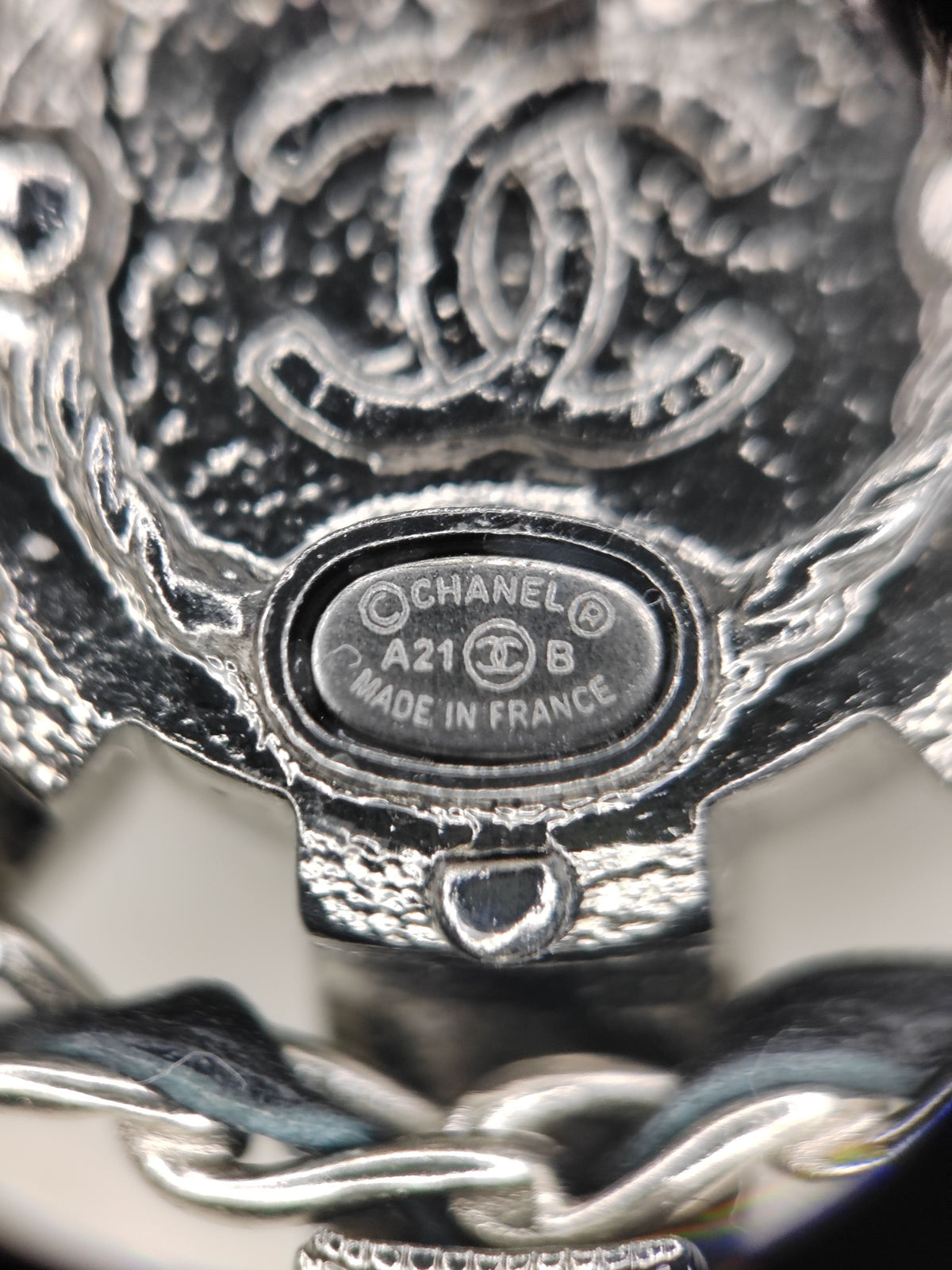 Chanel - Other - Silver-tone metal with rhinestone embellishment and a pearlescent-effect center. - Silver