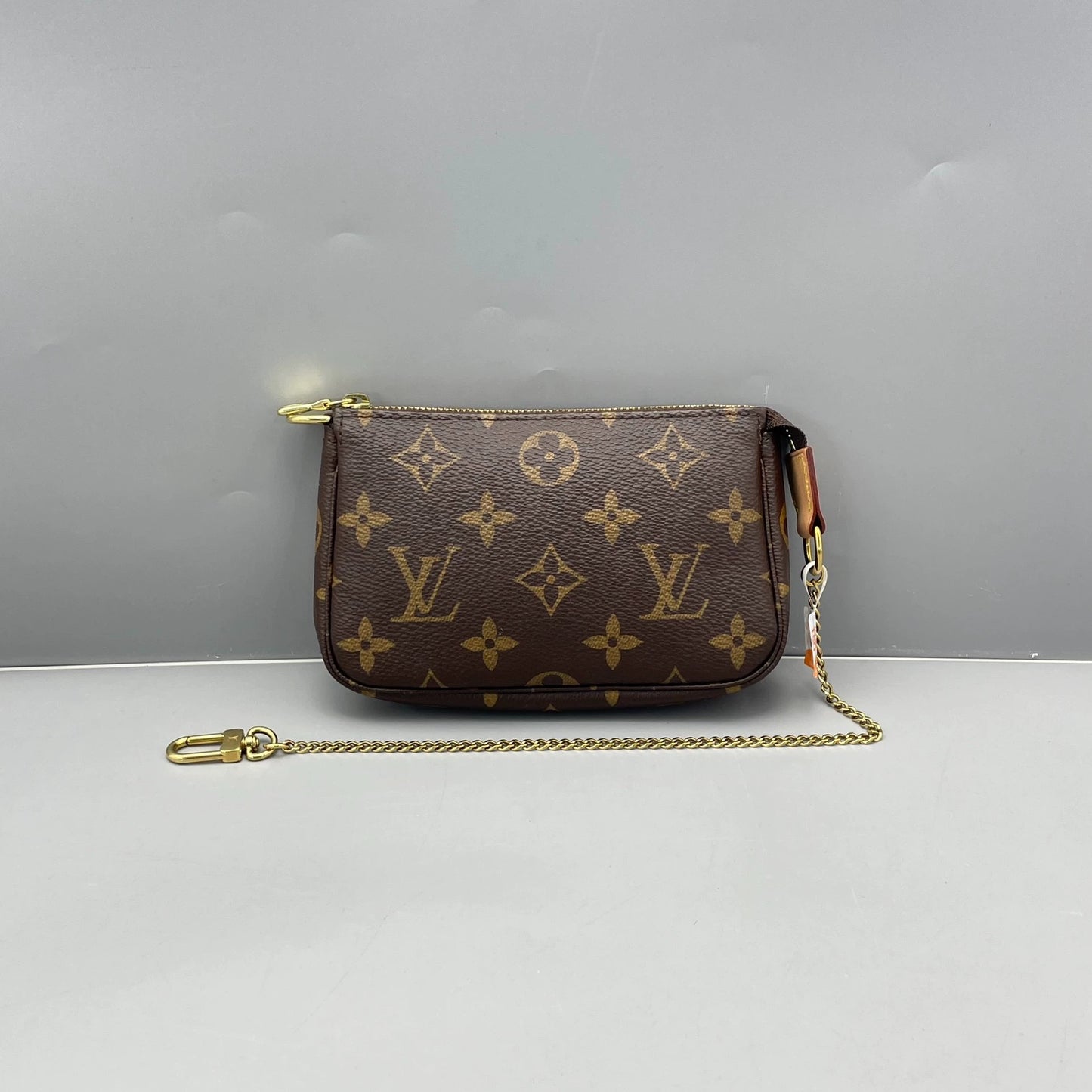Louis Vuitton - Mini Pochette Accessoires - Monogram coated canvas with natural cowhide leather trim - Brown - (mini)