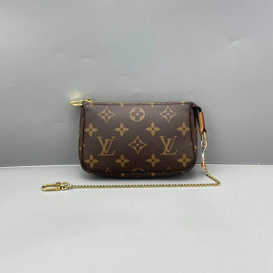 Louis Vuitton - Mini Pochette Accessoires - Monogram coated canvas with natural cowhide leather trim - Brown - (mini)