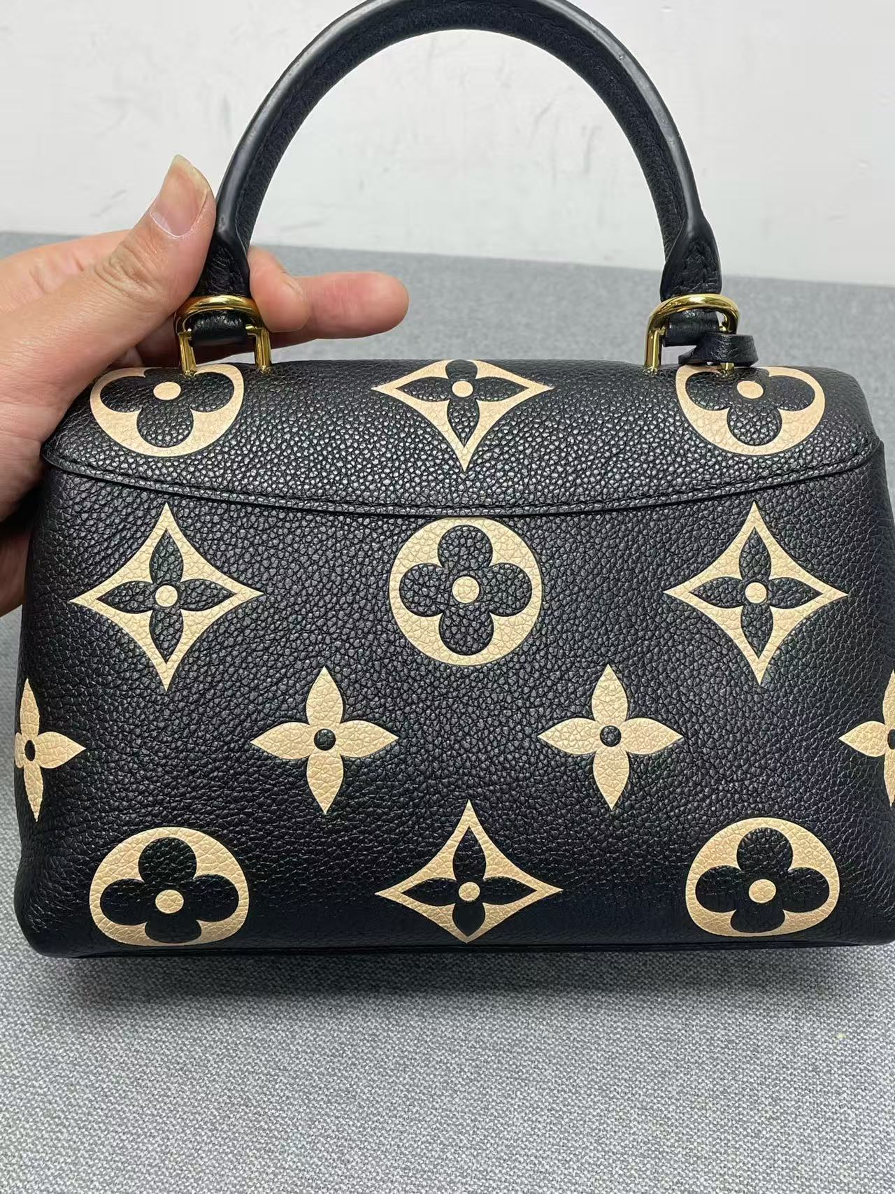Louis Vuitton - Madeleine Small - Grained leather - Black with Beige motifs and Red interior - (Small)