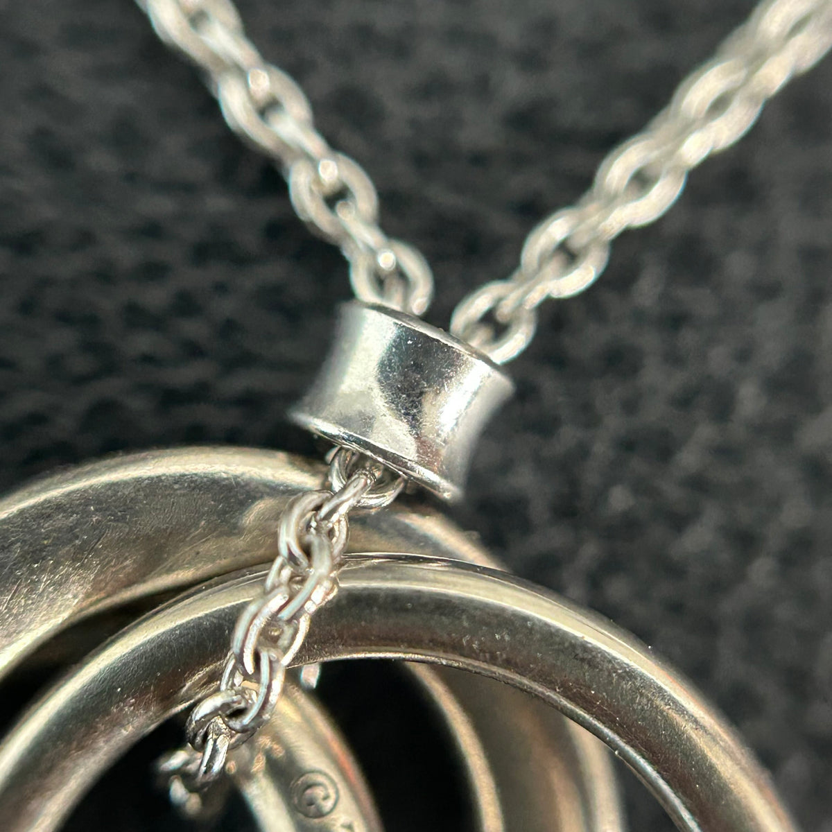 Tiffany & Co. - Interlocking Circles - Sterling silver; the pendant appears to bear a 925 hallmark. One circle is set with pave diamonds. - Silver