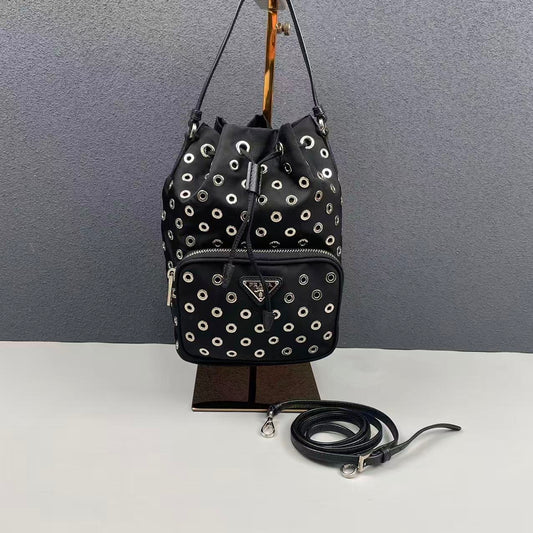 Prada - Grommet Embellished Drawstring Bucket Bag - Nylon fabric with leather trim - Black - (small)