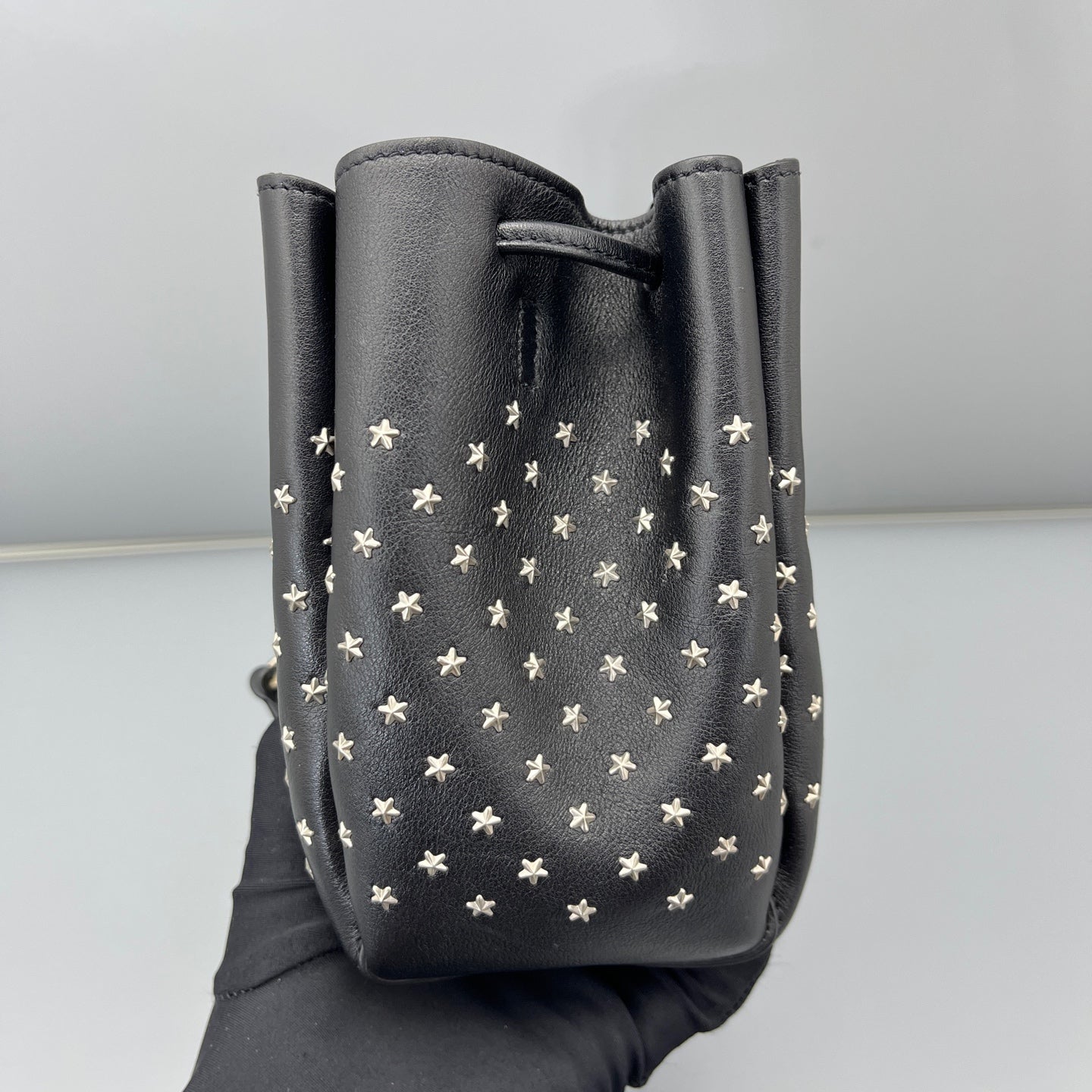 Saint Laurent - Studded Drawstring Bucket Bag - Grained leather - Black - (mini)