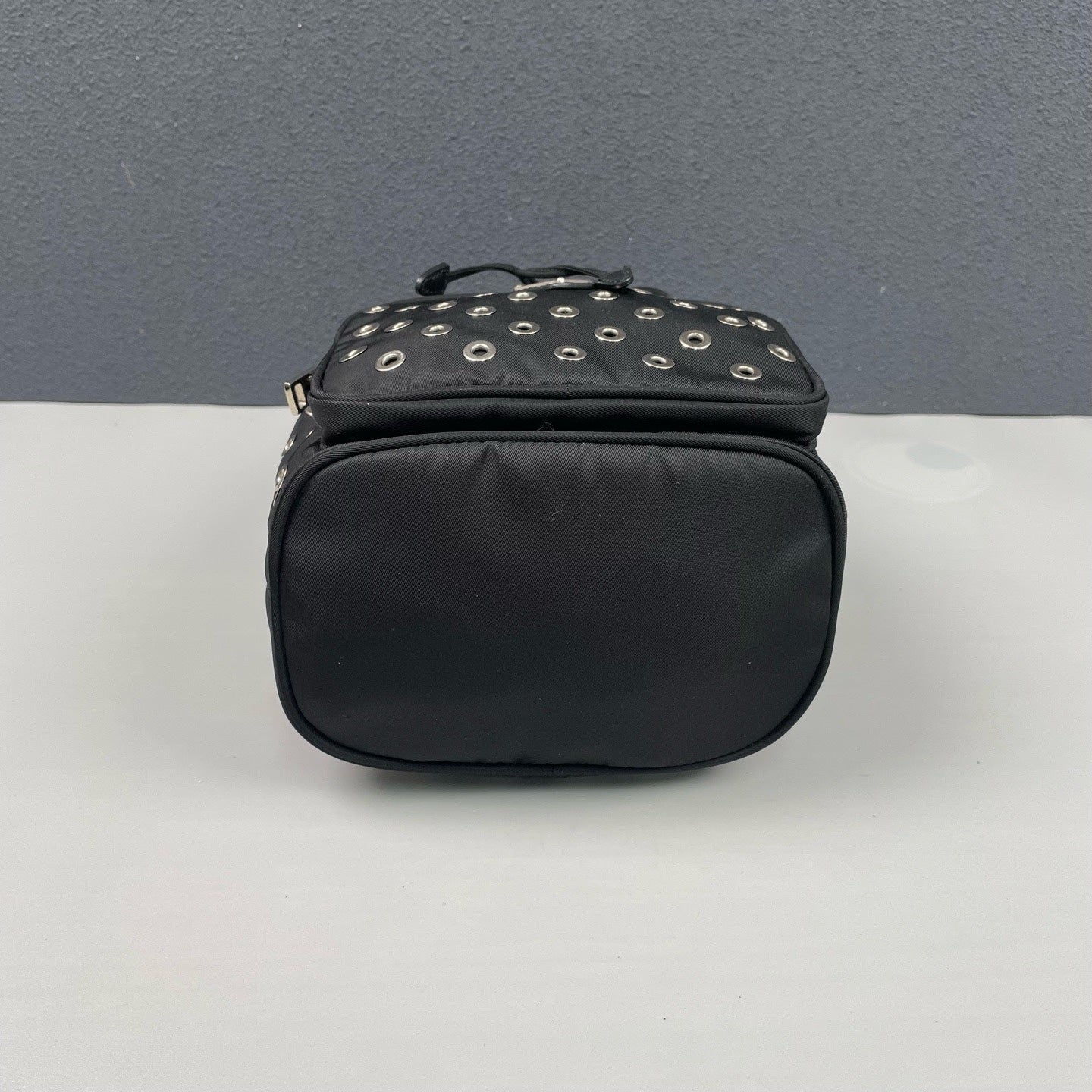 Prada - Grommet Embellished Drawstring Bucket Bag - Nylon fabric with leather trim - Black - (small)