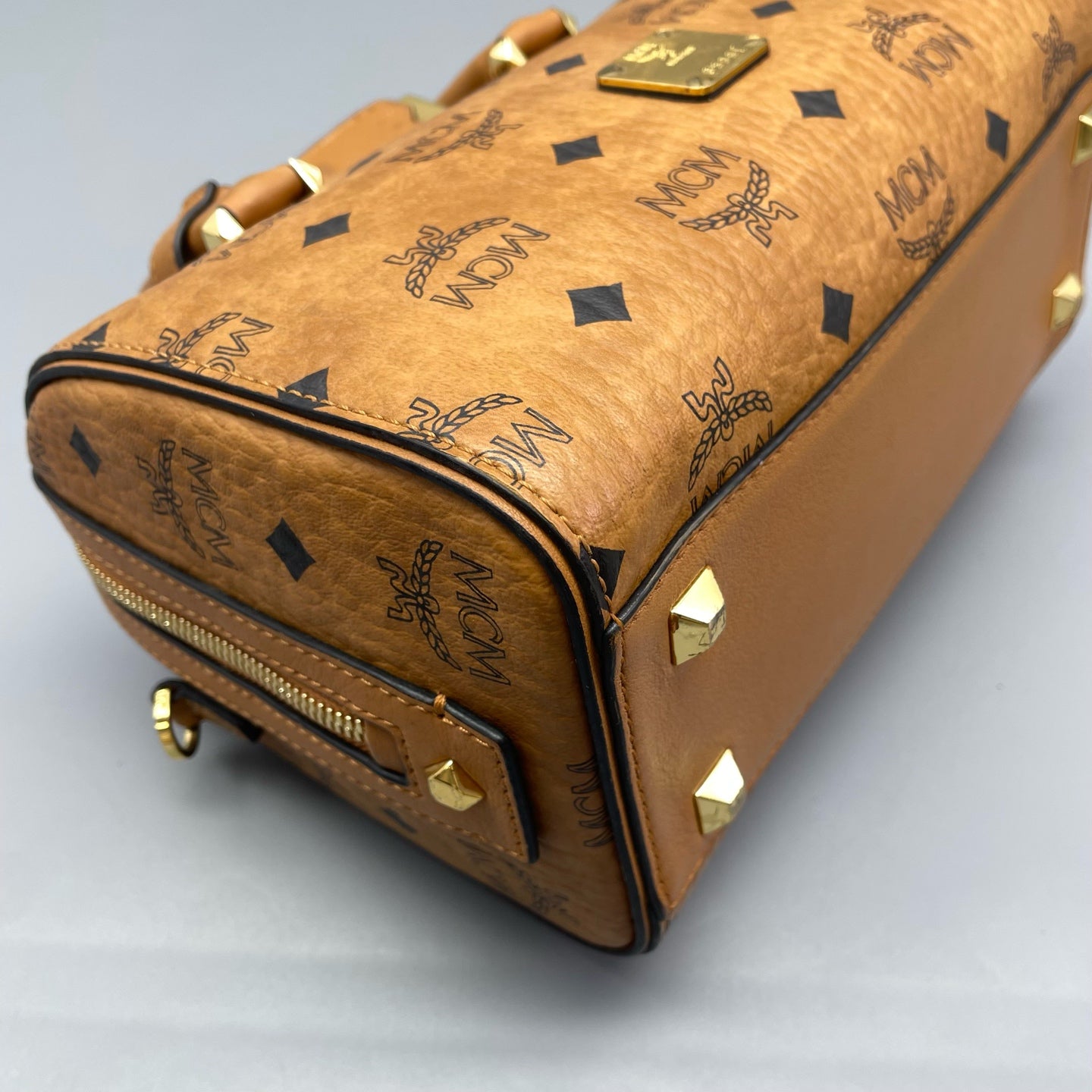 MCM - Visetos Boston Bag Small - Visetos coated canvas with leather trim - Cognac with black monogram - (small)