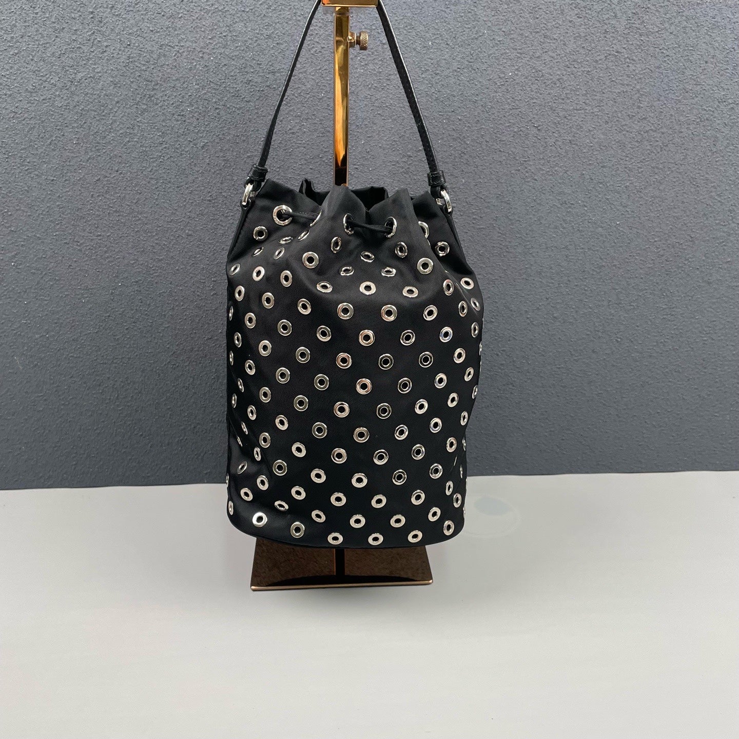Prada - Grommet Embellished Drawstring Bucket Bag - Nylon fabric with leather trim - Black - (small)