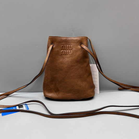 Miu Miu - Drawstring Mini Bucket Bag - Grained leather - Brown - (mini)
