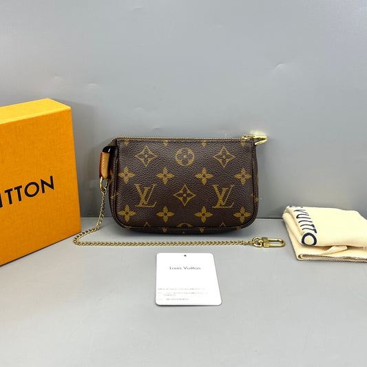 Louis Vuitton - Mini Pochette Accessoires - Monogram coated canvas with Vachetta leather trim and textile lining - Brown - (mini)