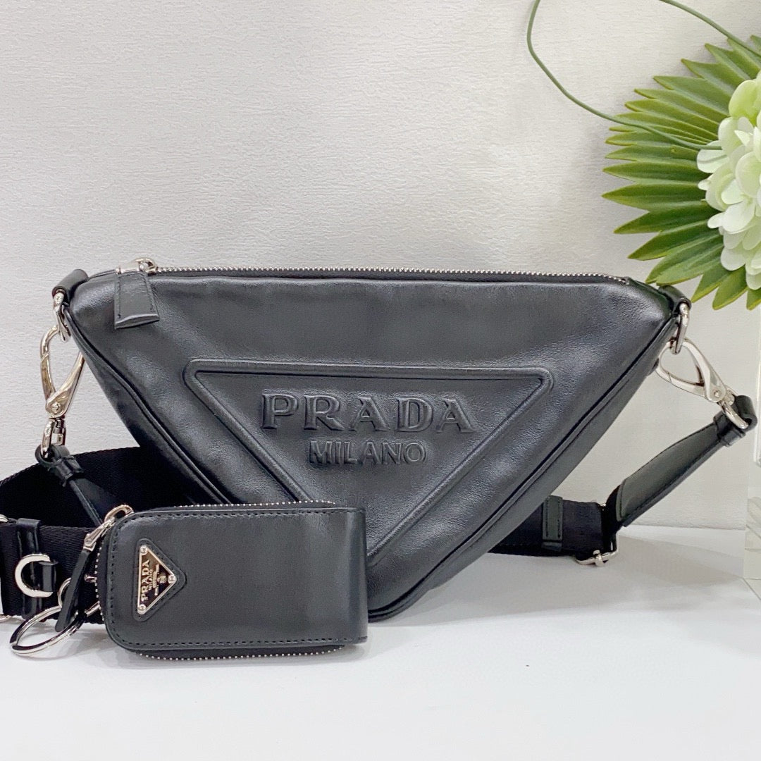 Prada - Embossed Logo Triangle Crossbody Bag - Smooth leather with fabric strap - Black - (medium)