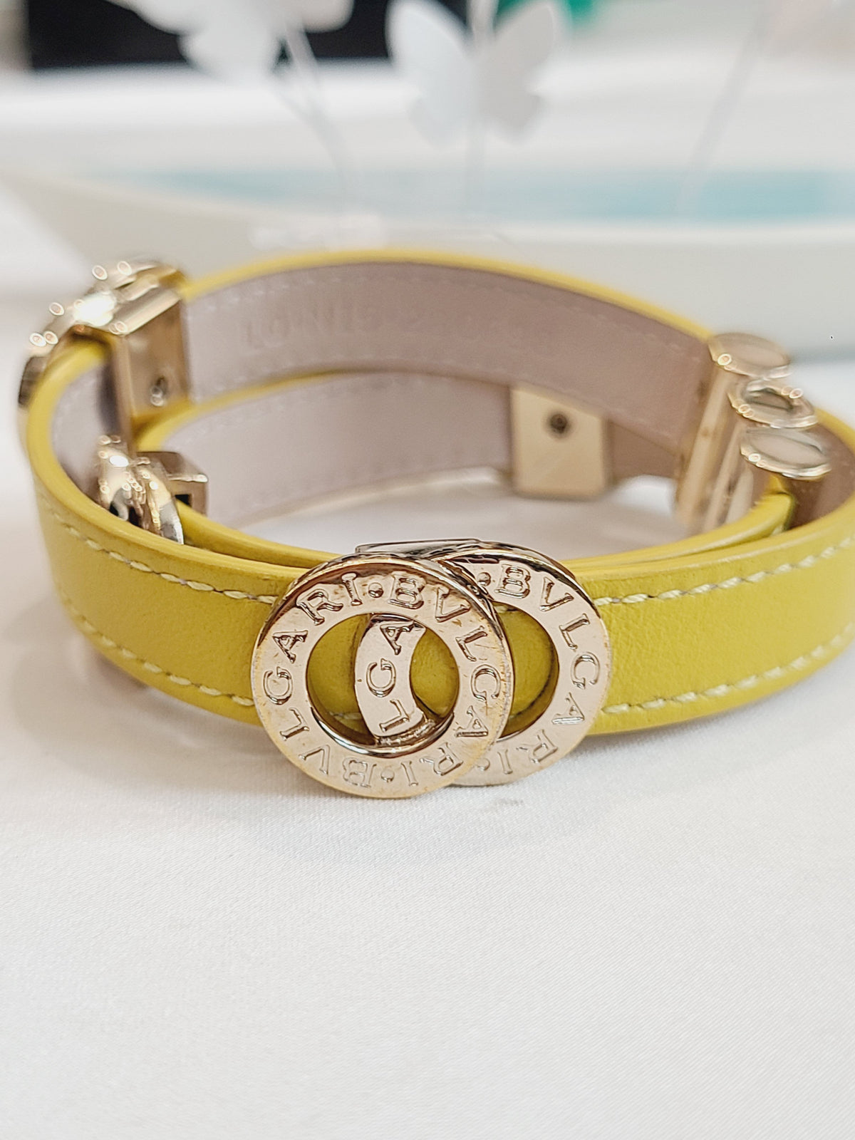 Bvlgari - Bvlgari Bvlgari - Gold-tone metal logo and clasp hardware with a calfskin leather strap. - Yellow