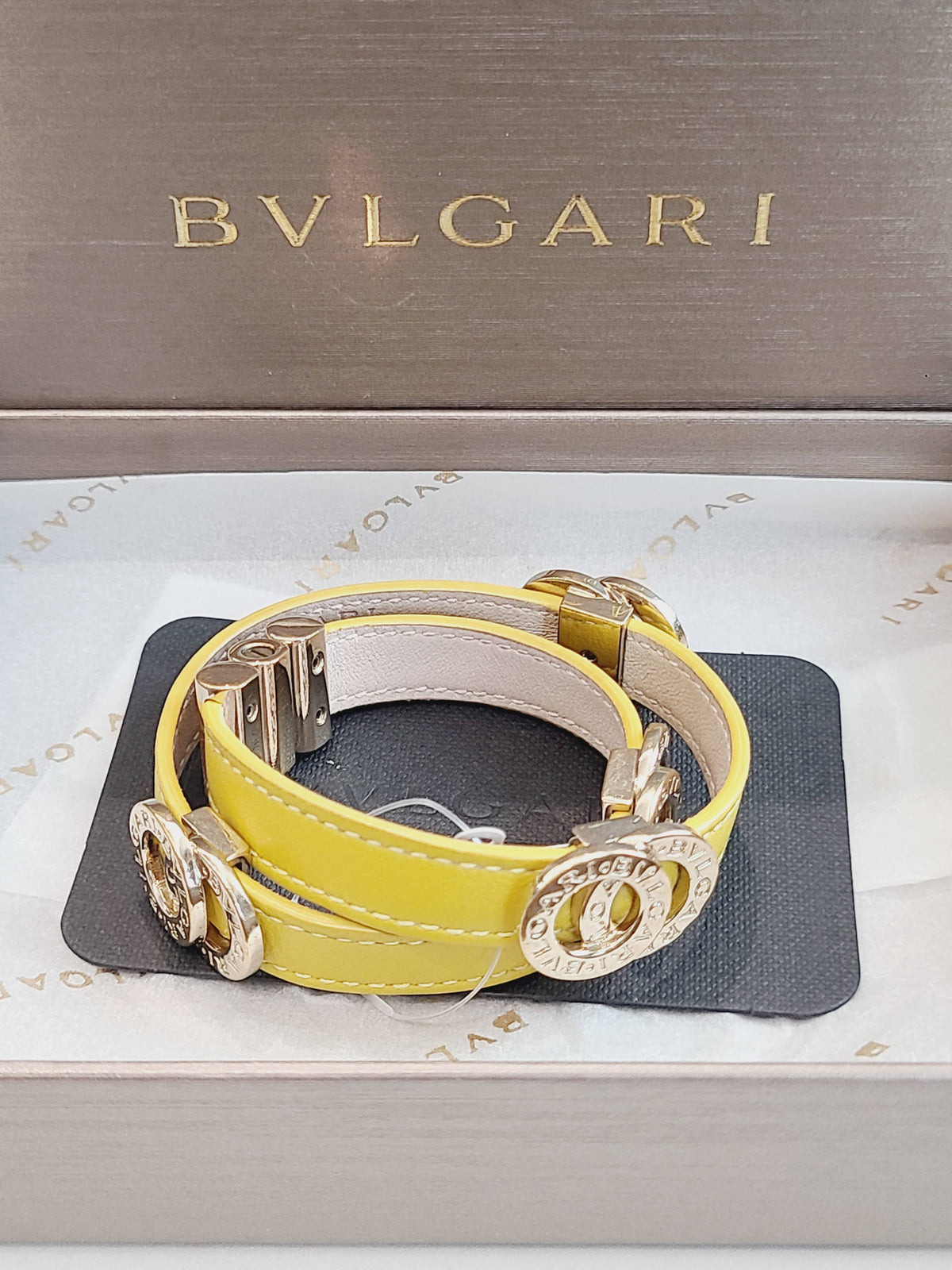 Bvlgari - Bvlgari Bvlgari - Gold-tone metal logo and clasp hardware with a calfskin leather strap. - Yellow