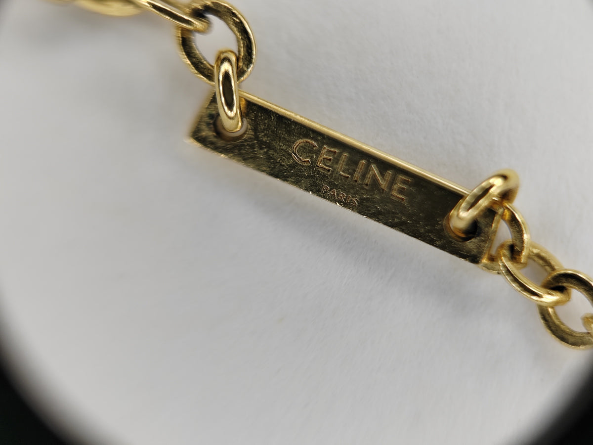 Celine - Other - Gold-tone metal chain and letter charms with clear rhinestone embellishments. - Gold