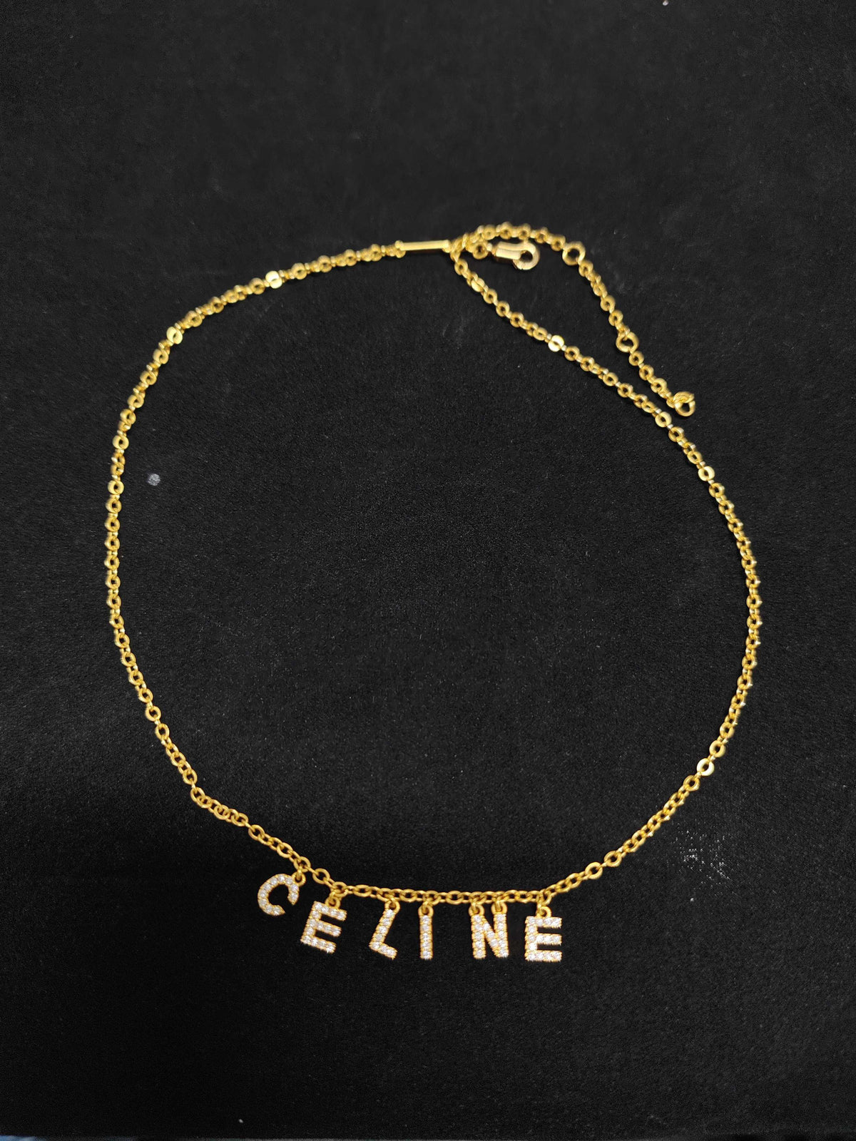 Celine - Other - Gold-tone metal chain and letter charms with clear rhinestone embellishments. - Gold