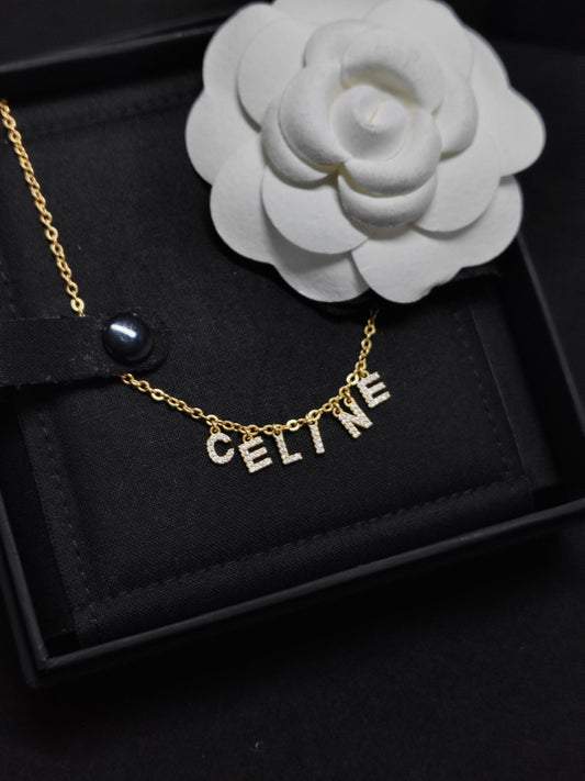 CELINE - Other - Gold-tone metal with clear crystal embellishments; base metal composition unspecified. - Gold