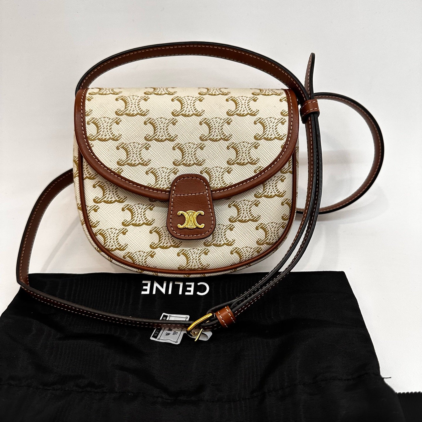 Celine - Triomphe Canvas Mini Saddle Crossbody Bag - Coated Triomphe canvas with smooth leather trim - Beige and Brown - (Mini)