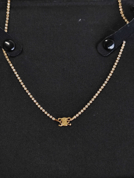 Celine - Triomphe - Gold-tone metal with clear rhinestone embellishments; specific base-metal composition is not established. - Gold