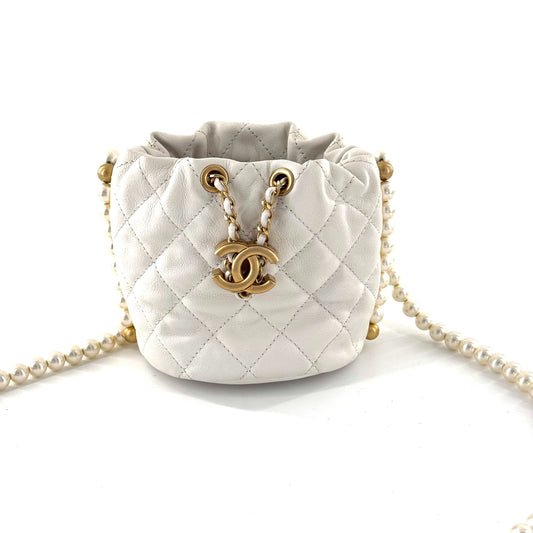 Chanel - 21S Pearl Mini Drawstring Bucket Bag - Lambskin leather and faux pearls - White with Gold-Tone Hardware - (Mini)