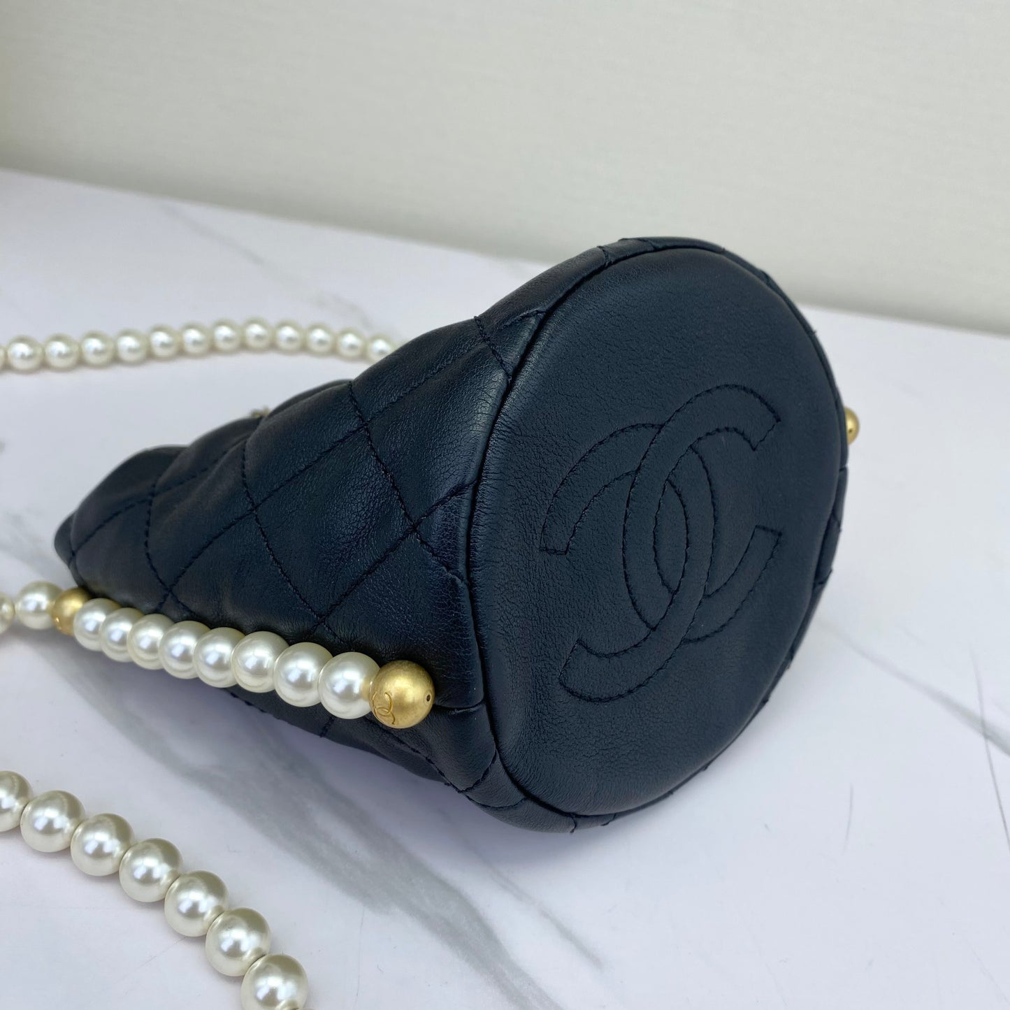 Chanel - Bucket Bag with Pearl Chain - Caviar leather - Black - (mini)