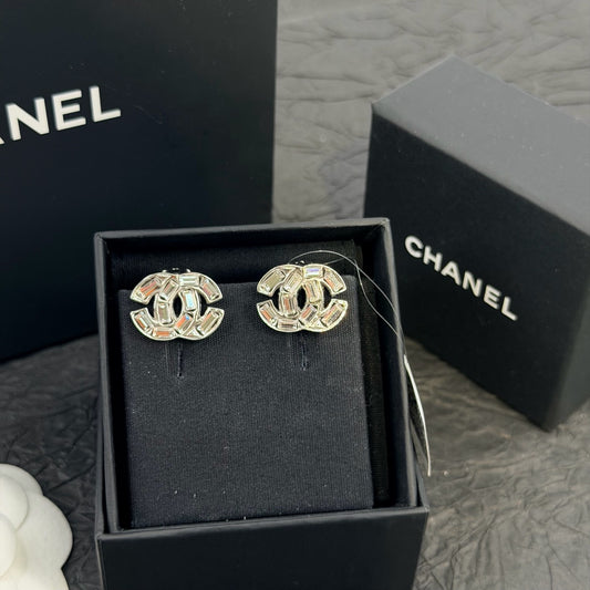 Chanel - Other - Base metal with clear faceted crystal embellishments and a silver-tone finish. - Silver