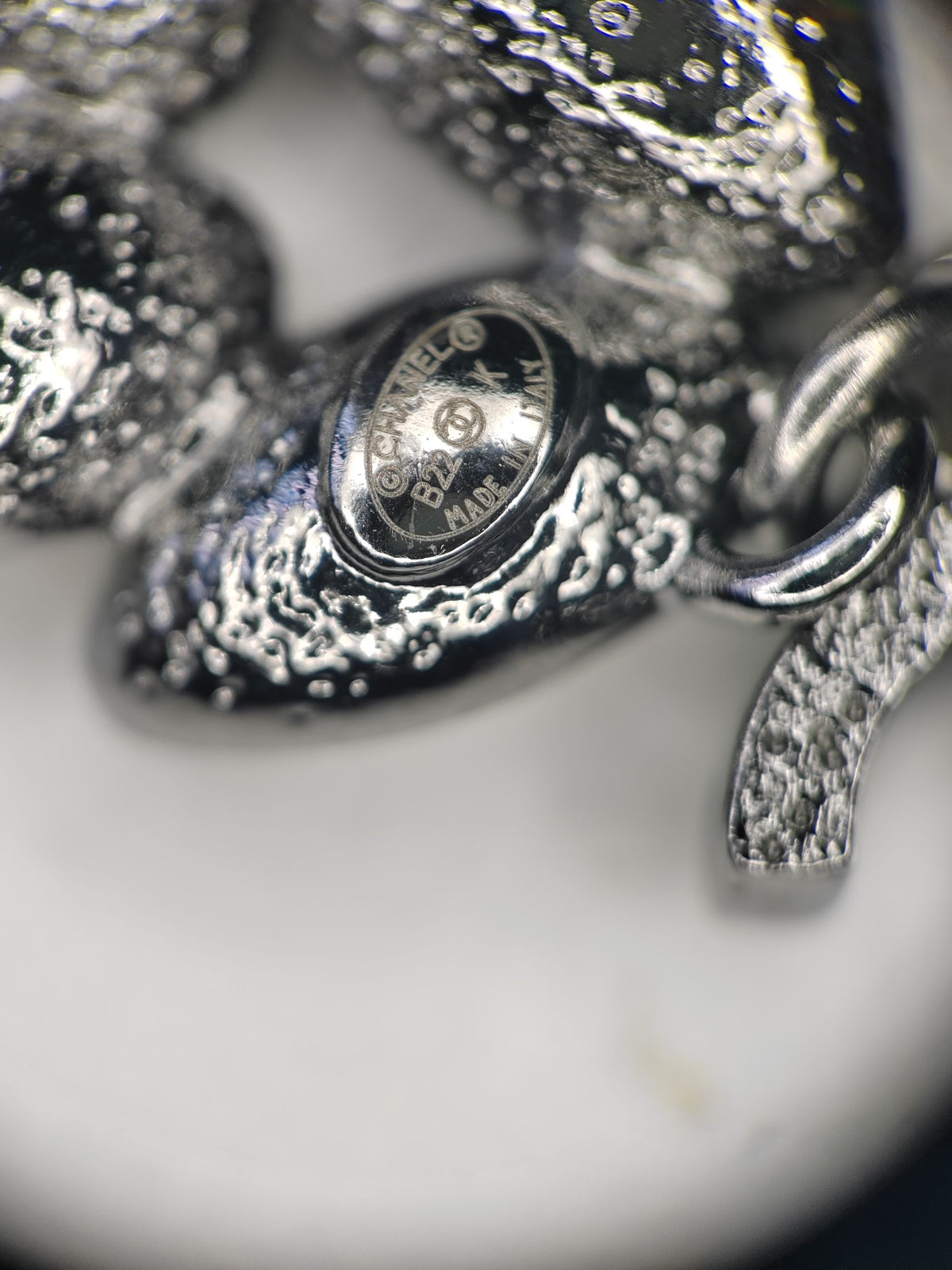 Chanel - Other - Base metal with crystal embellishments. - Silver