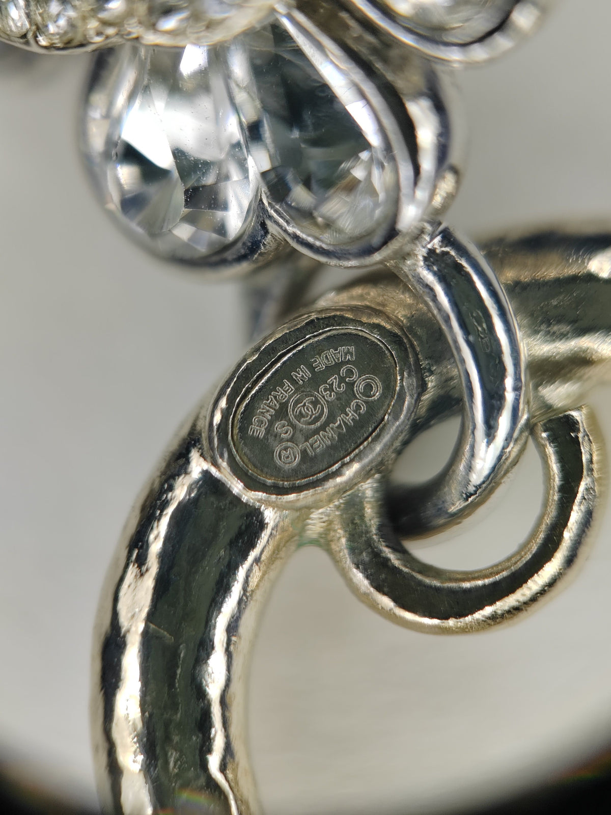 Chanel - Other - Base metal with gold-tone and silver-tone finishes and clear rhinestone embellishments. - Multicolour