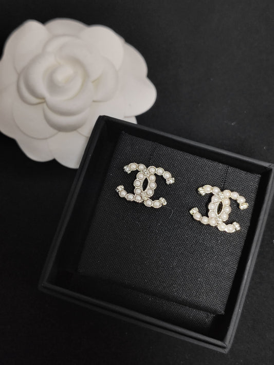 Chanel - Other - Base metal with imitation pearl and crystal accents. - Silver