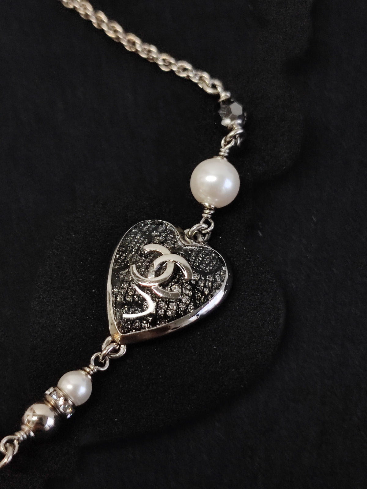Chanel - Other - Base metal with imitation pearls and crystal embellishments; silver-tone finish. - Black