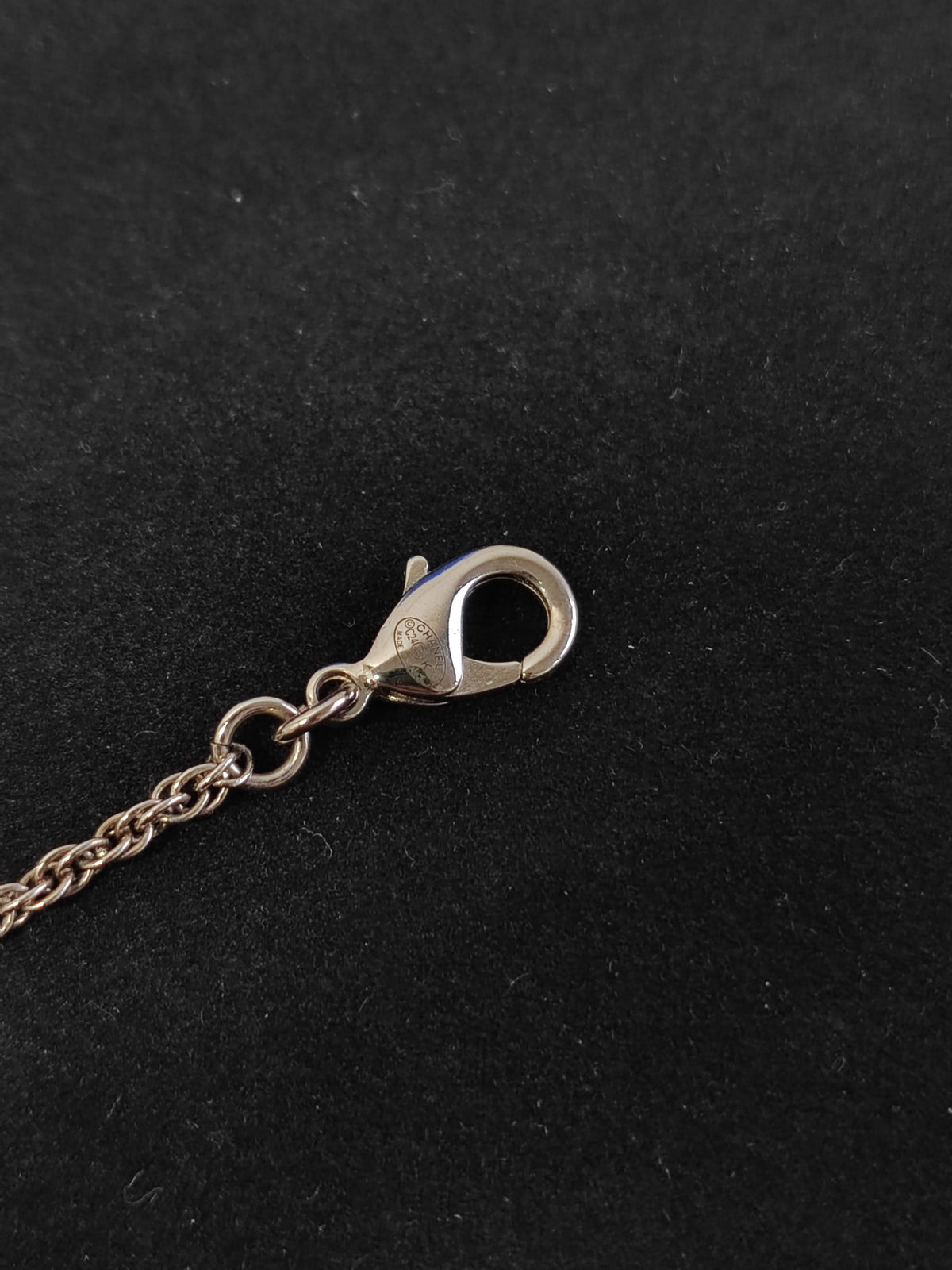 Chanel - Other - Base metal with imitation pearls and crystal embellishments; silver-tone finish. - Black