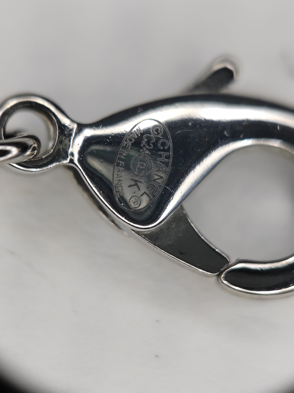 Chanel - Other - Base metal with imitation pearls and crystal embellishments; silver-tone finish. - Black