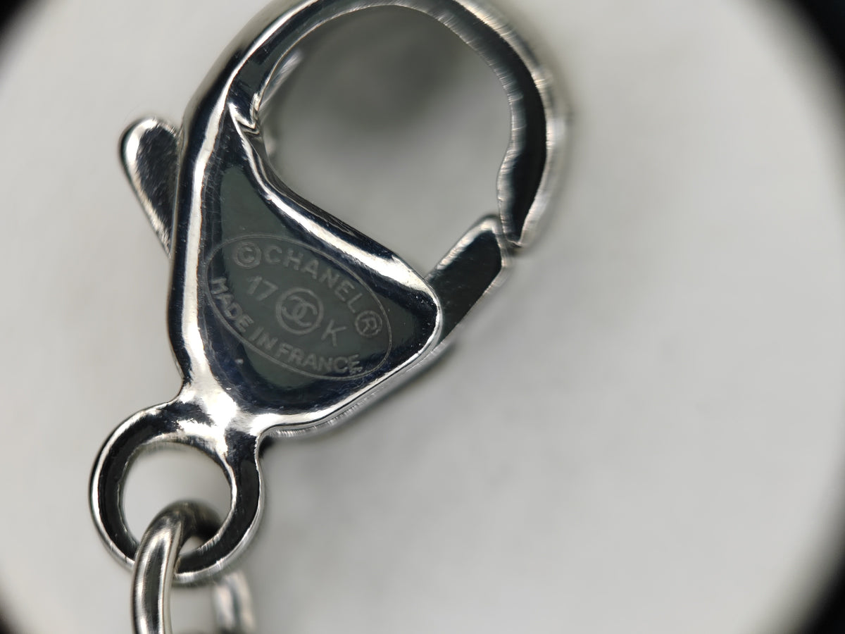 Chanel - Other - Costume jewellery metal with rhinestone embellishments and an acrylic or resin pendant. - Purple