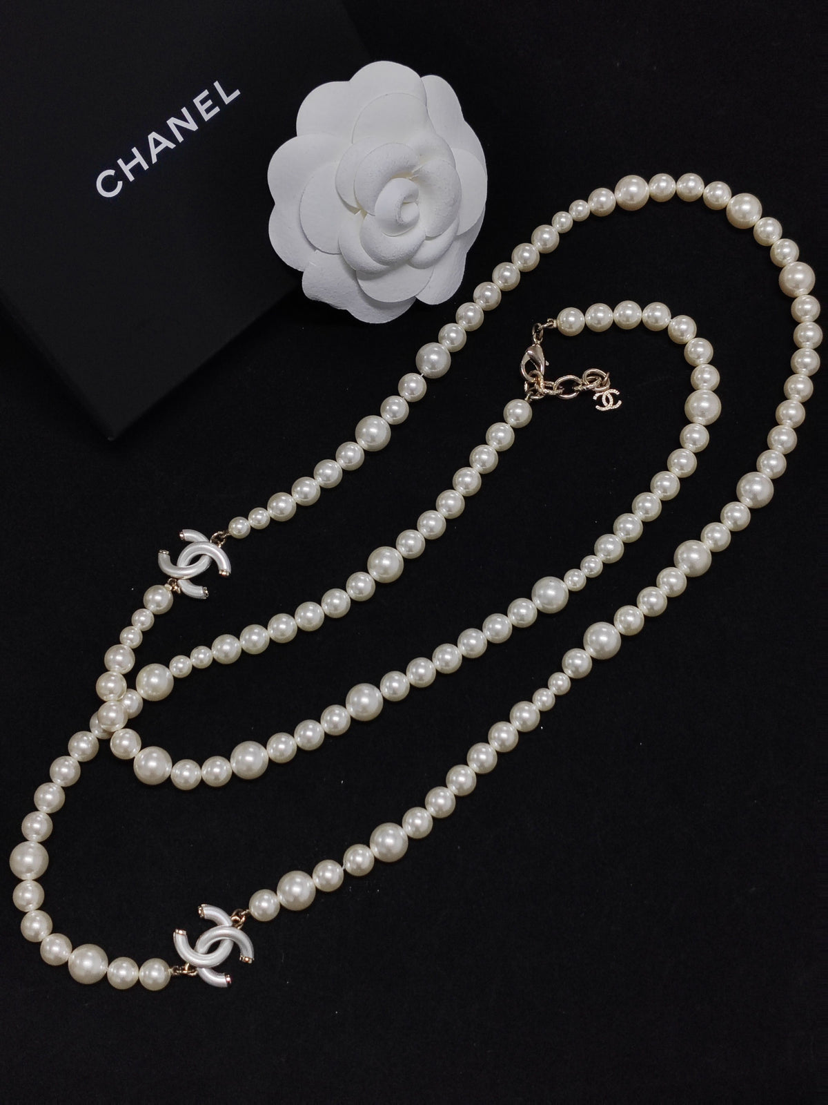 Chanel - Other - Costume-jewelry metal alloy with imitation pearls and white decorative accents. - White