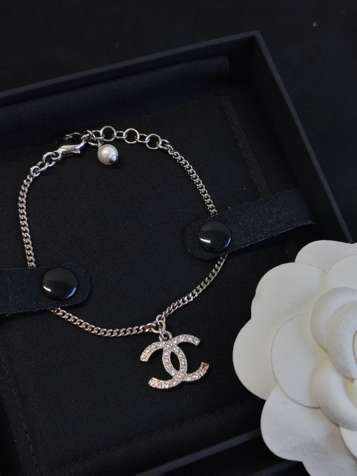 Chanel - Other - Costume-jewelry metal with clear crystal-like stones and a pearl-style bead. - Silver