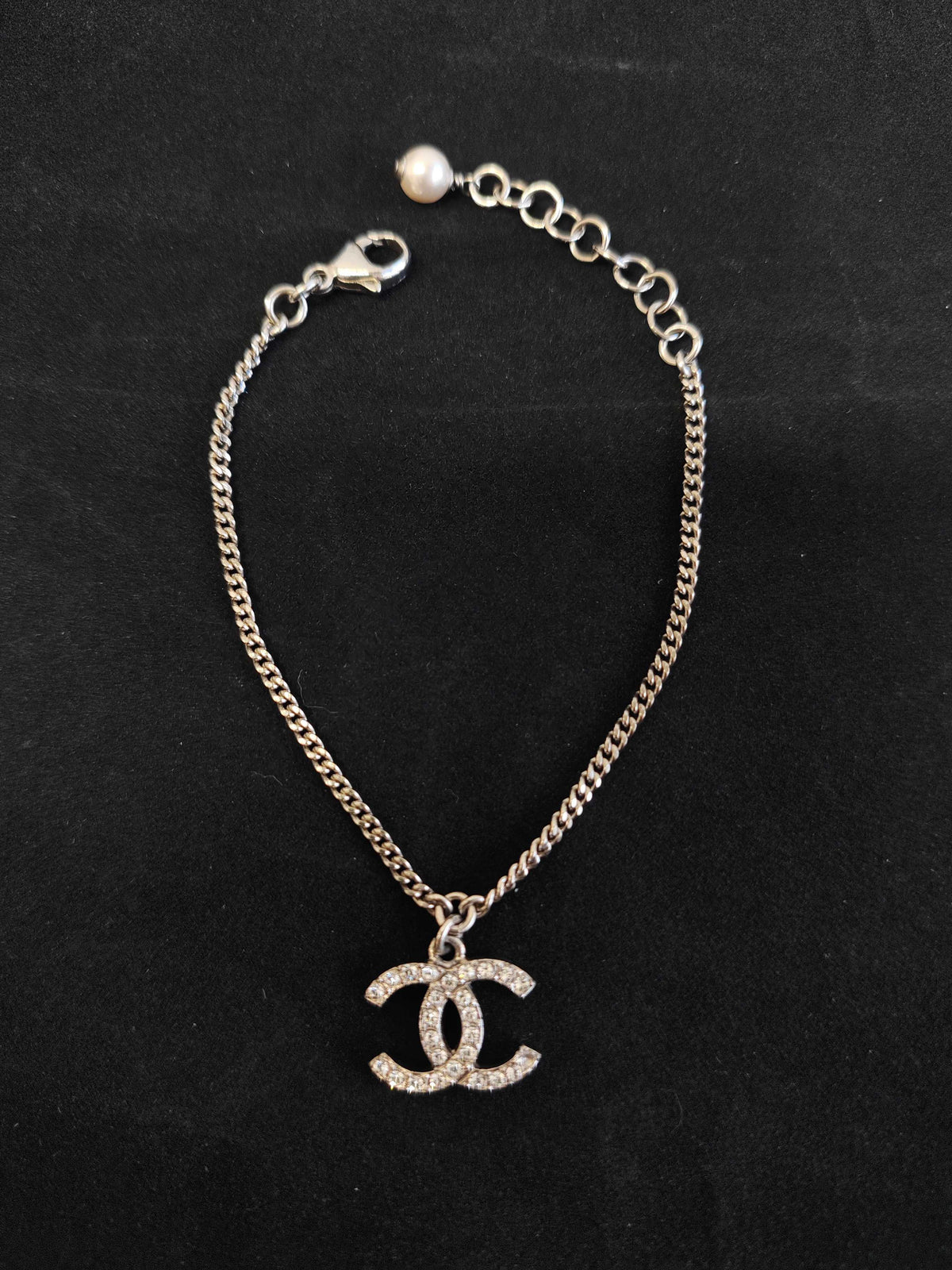 Chanel - Other - Costume-jewelry metal with clear crystal-like stones and a pearl-style bead. - Silver