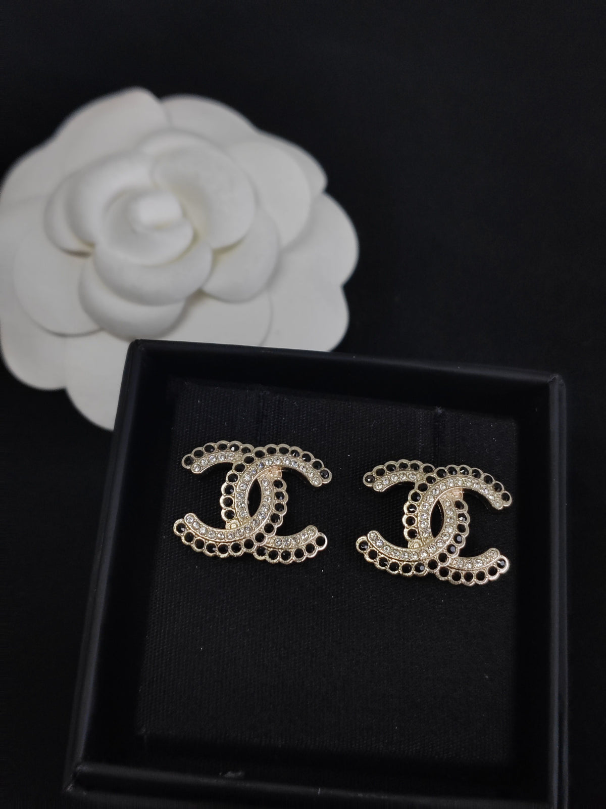 Chanel - Other - Gold-tone base metal with black and clear rhinestone embellishments. - Gold