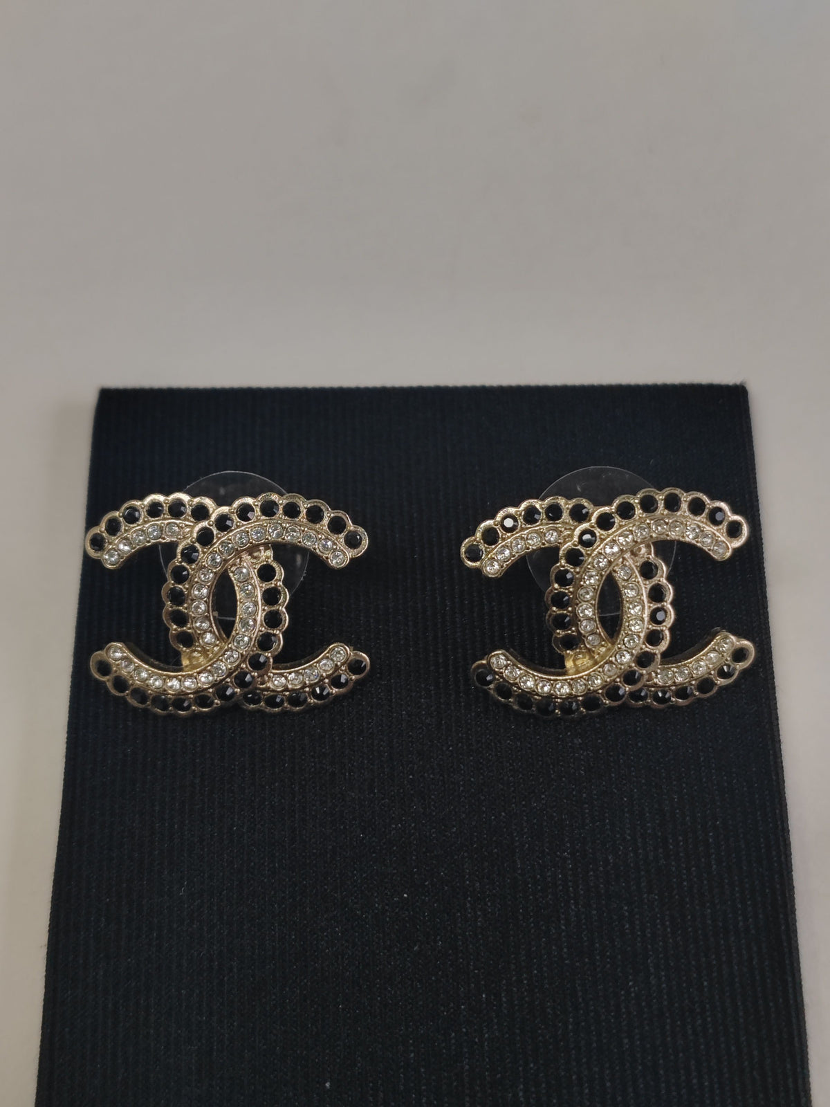Chanel - Other - Gold-tone base metal with black and clear rhinestone embellishments. - Gold
