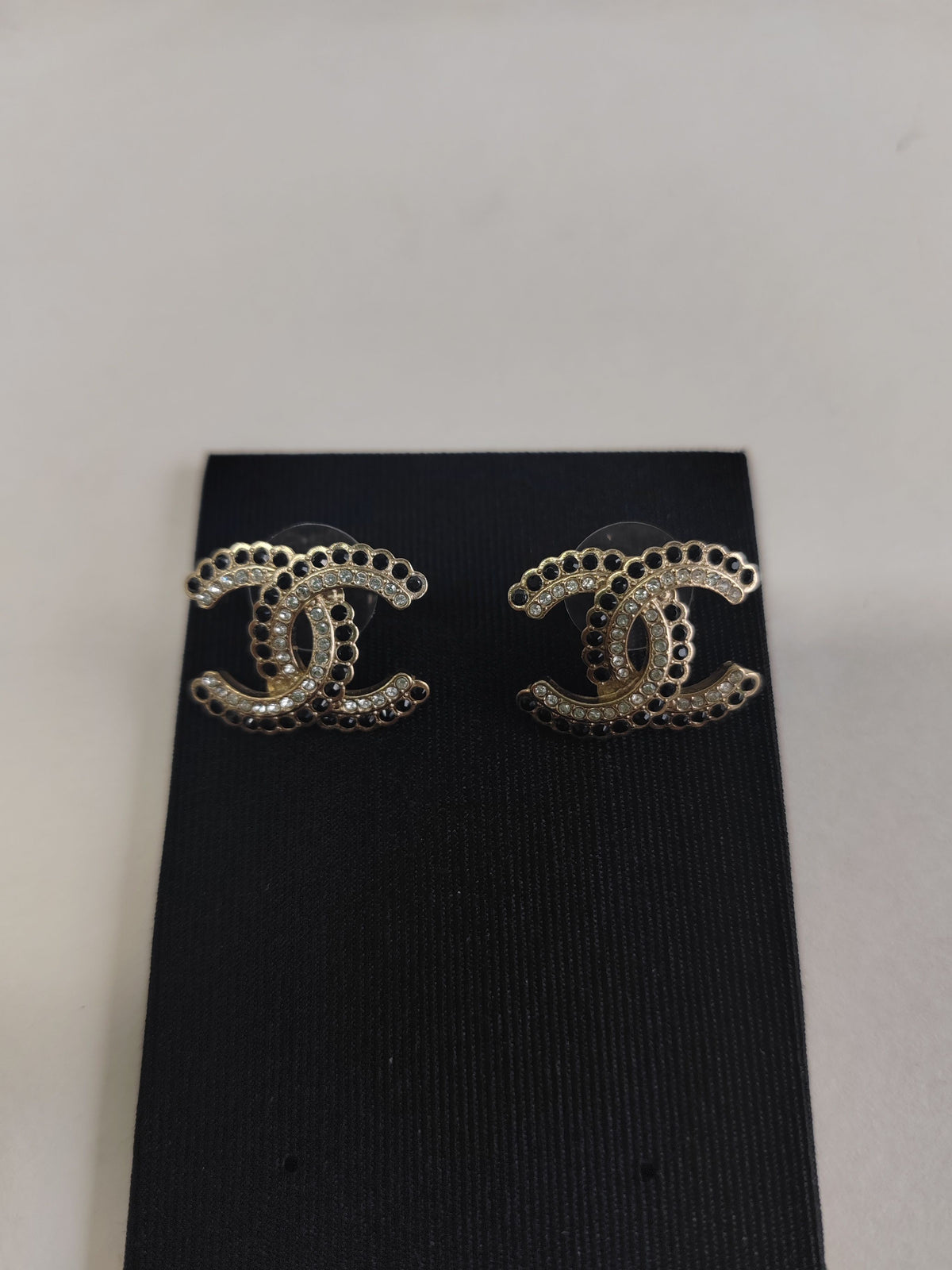 Chanel - Other - Gold-tone base metal with black and clear rhinestone embellishments. - Gold