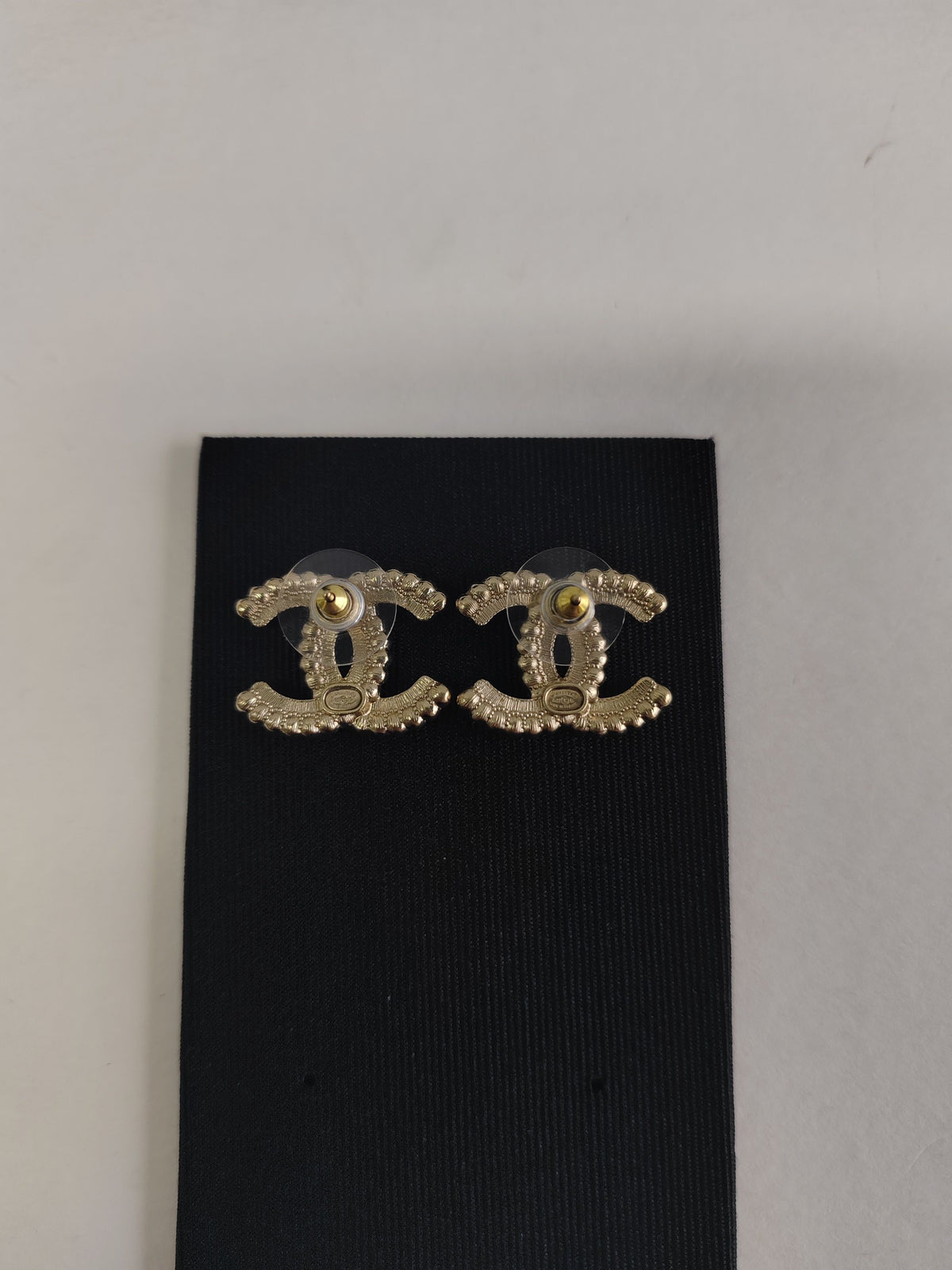 Chanel - Other - Gold-tone base metal with black and clear rhinestone embellishments. - Gold