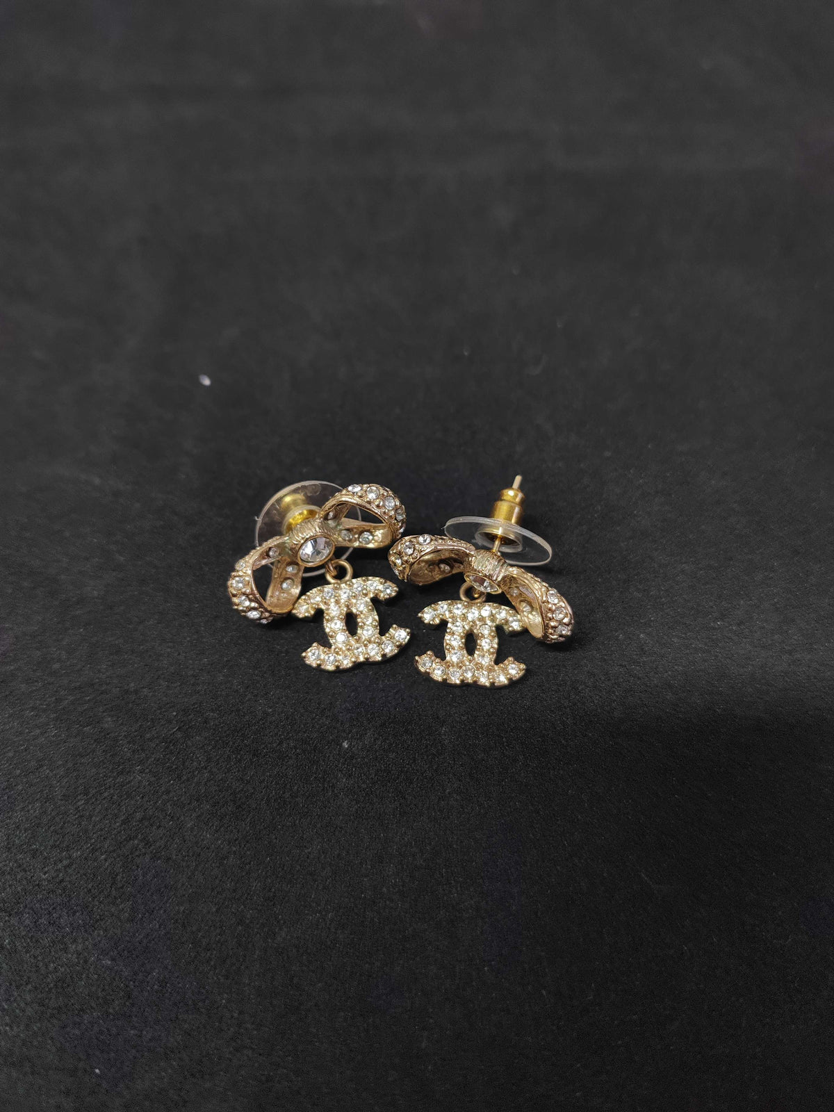 Chanel - Other - Gold-tone base metal with clear rhinestone embellishments; exact alloy and stone composition are unconfirmed. - Gold