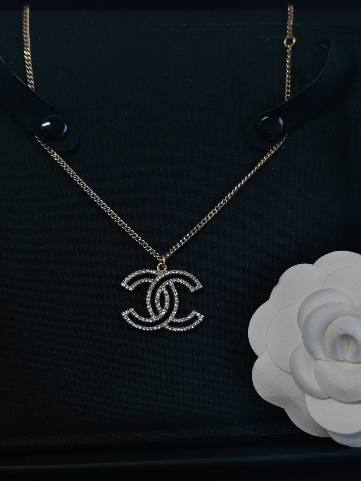 Chanel - Other - Gold-tone base metal with clear rhinestone embellishments. - Gold