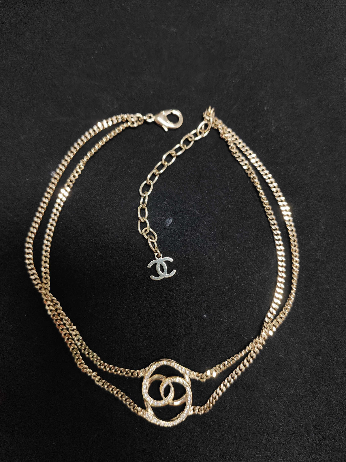 Chanel - Other - Gold-tone base metal with clear rhinestone embellishments. - Gold