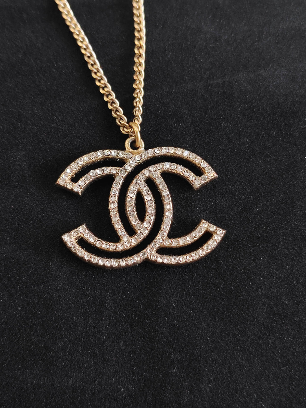 Chanel - Other - Gold-tone base metal with clear rhinestone embellishments. - Gold