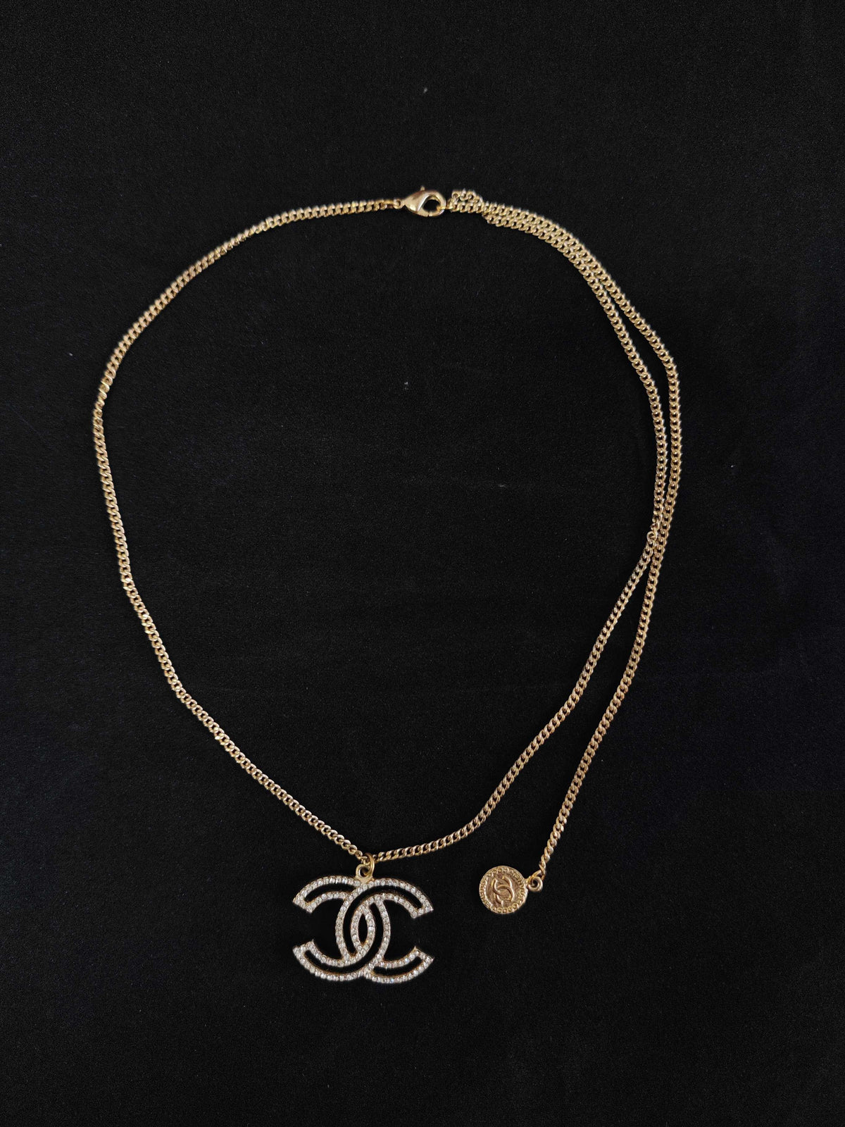 Chanel - Other - Gold-tone base metal with clear rhinestone embellishments. - Gold