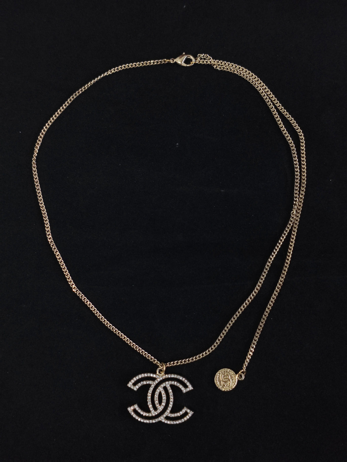 Chanel - Other - Gold-tone base metal with clear rhinestone embellishments. - Gold