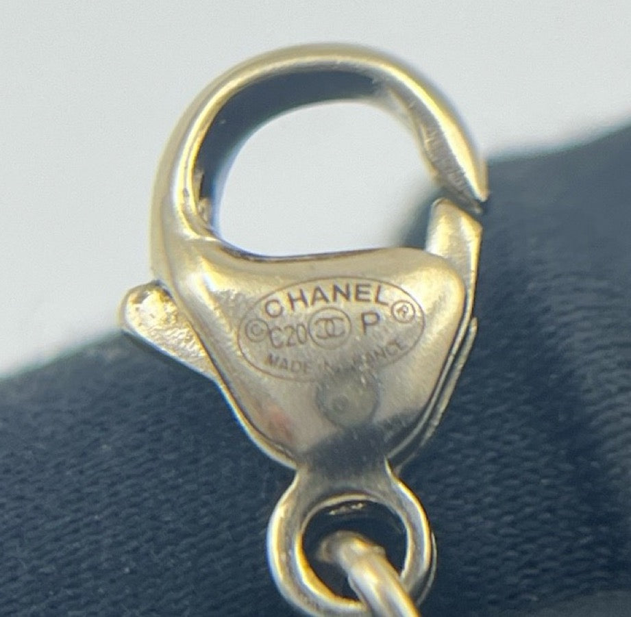 Chanel - Other - Gold-tone base metal with faux pearl and black glass accents. - Gold - (Medium-long)