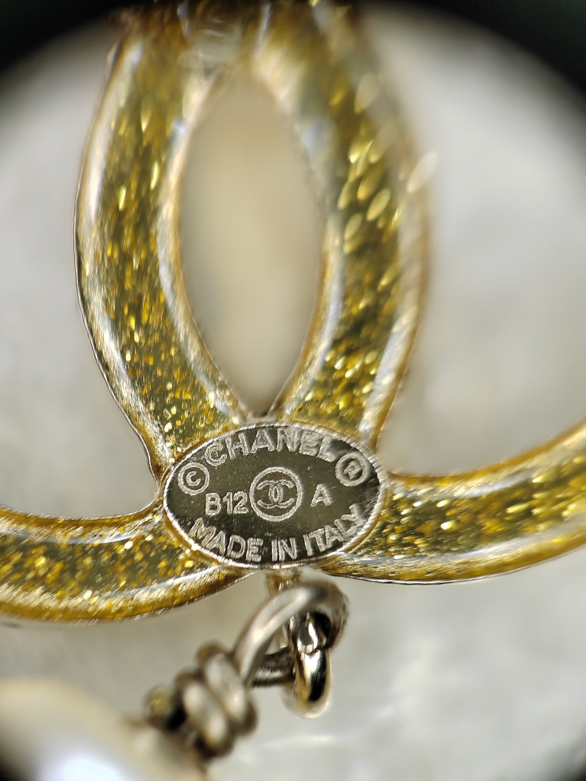 Chanel - Other - Gold-tone base metal with imitation pearls and clear and black rhinestone-style stones. - Multicolour
